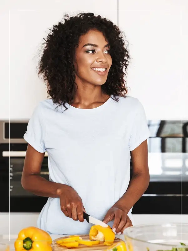 Black woman in a kitchen.